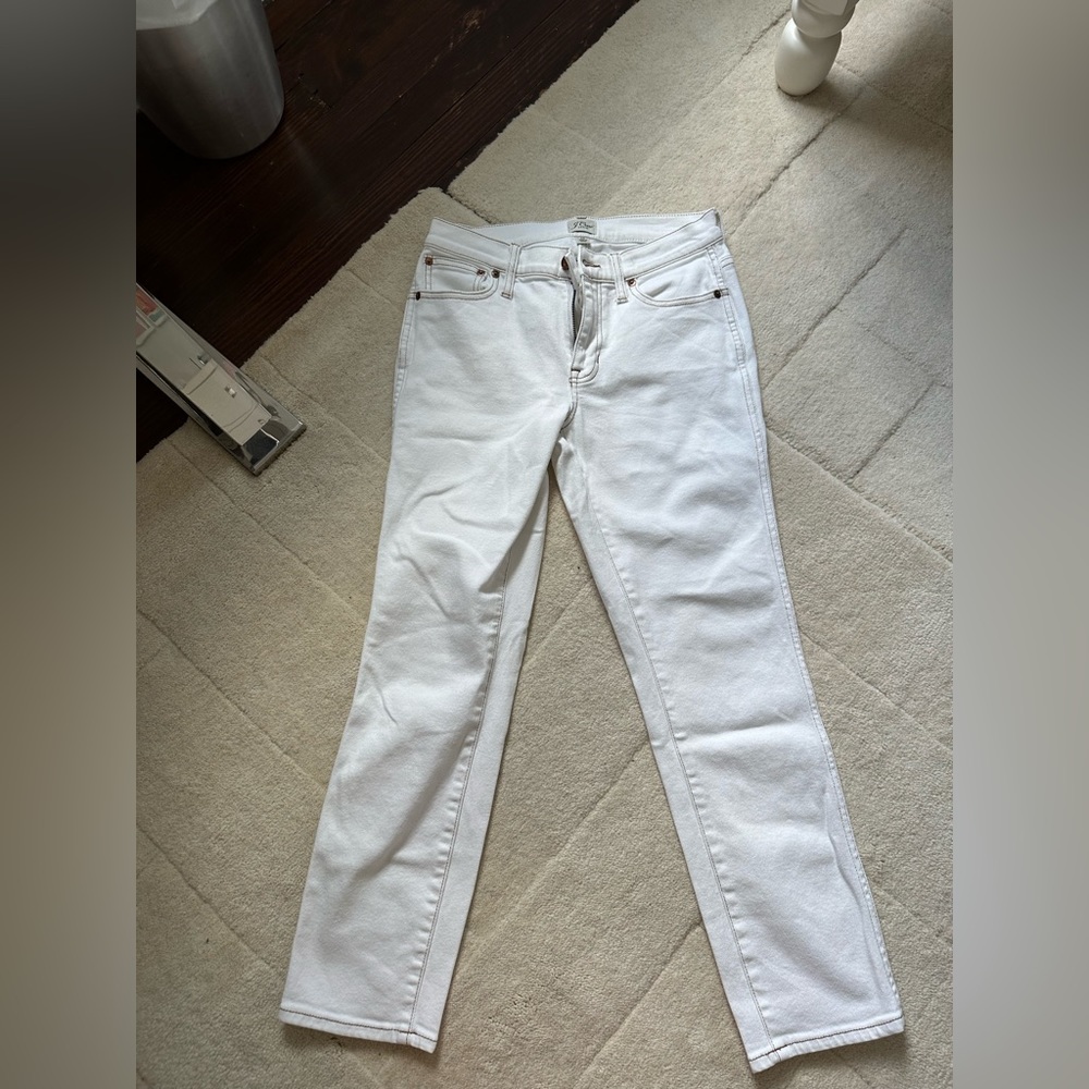 J.Crew white jeans with red stitch detailing.